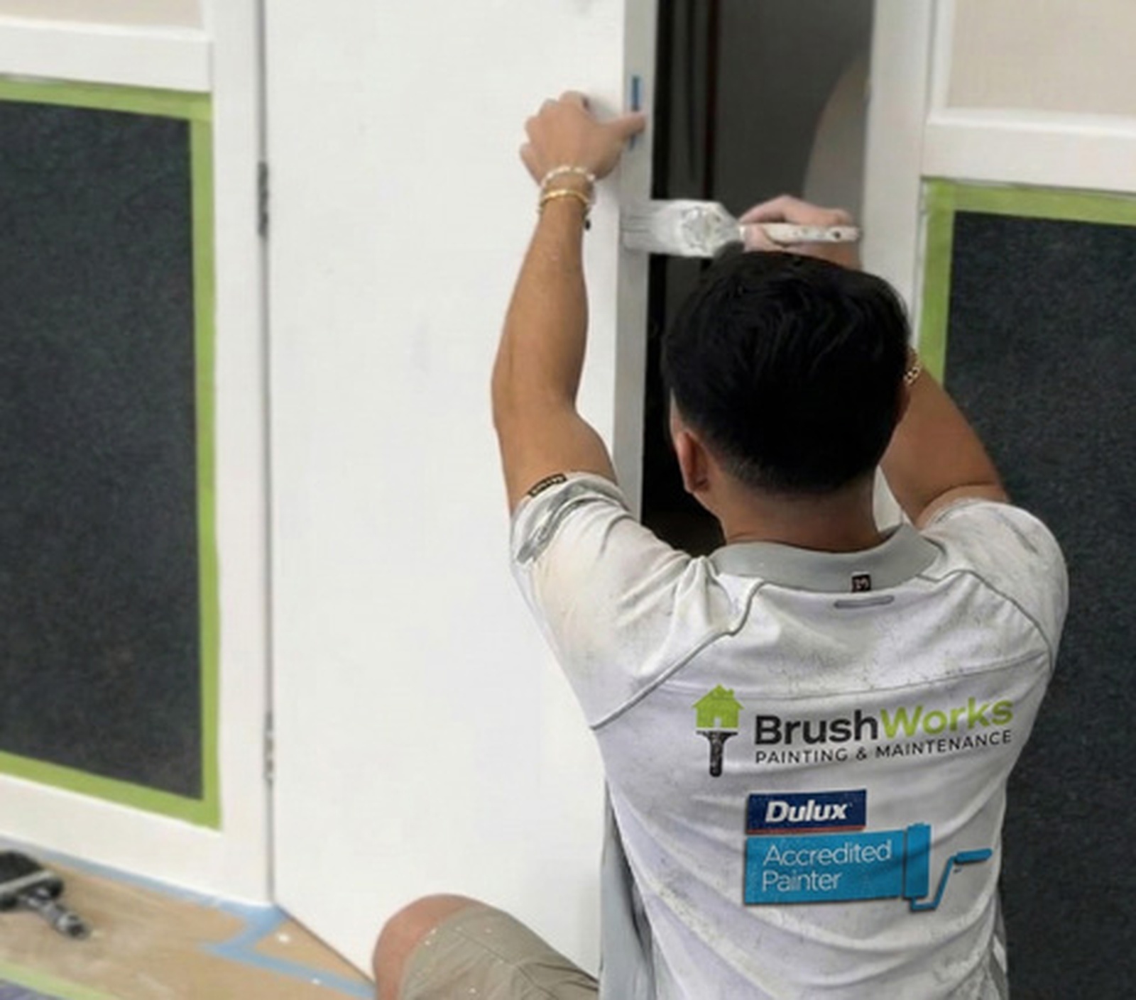 Brushworks painter working on detailed trim painting