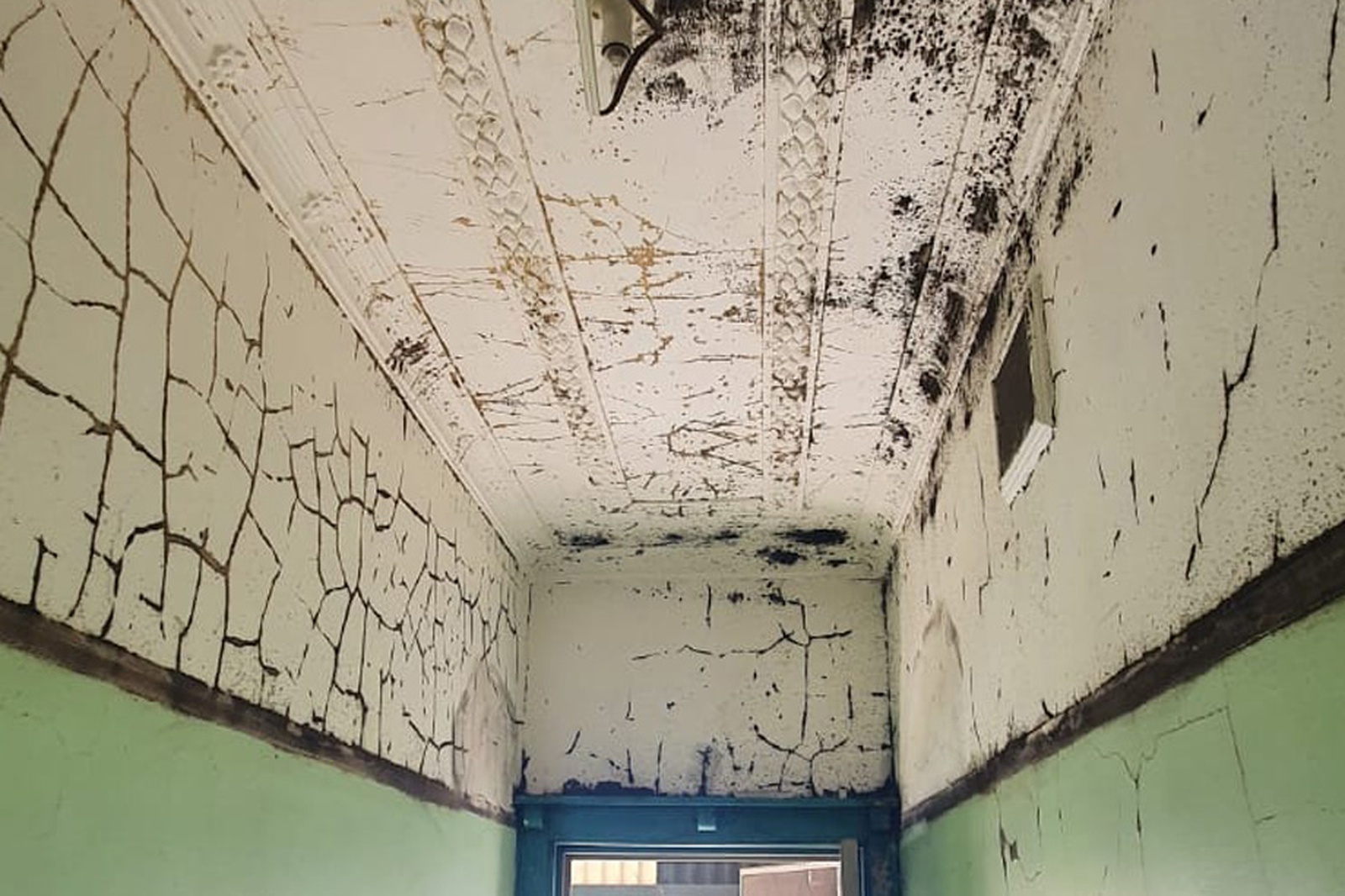 Before image showing cracked paint and ageing surfaces in an Inner West-style interior