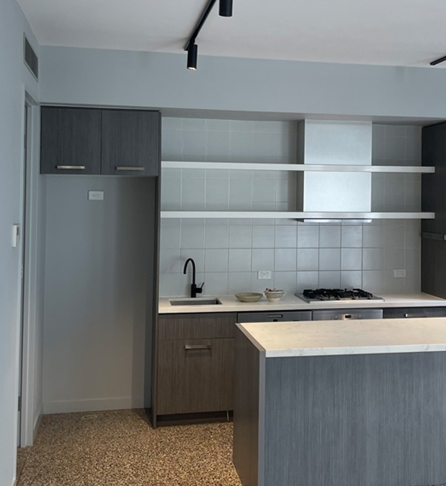 Freshly painted apartment kitchen and living area