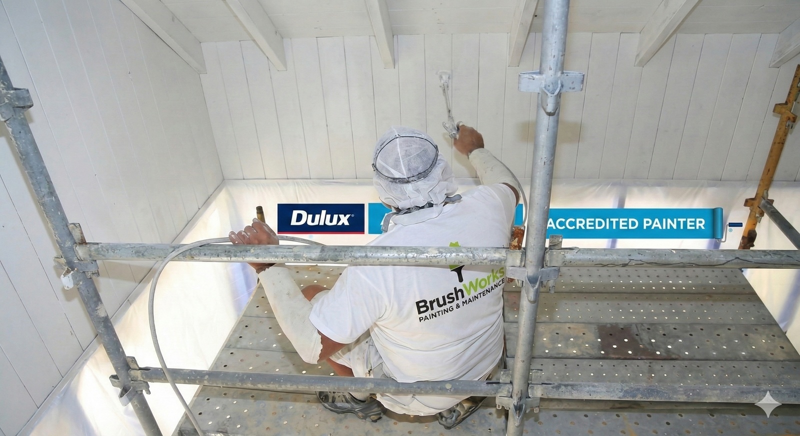 Brushworks painter carefully working on interior walls