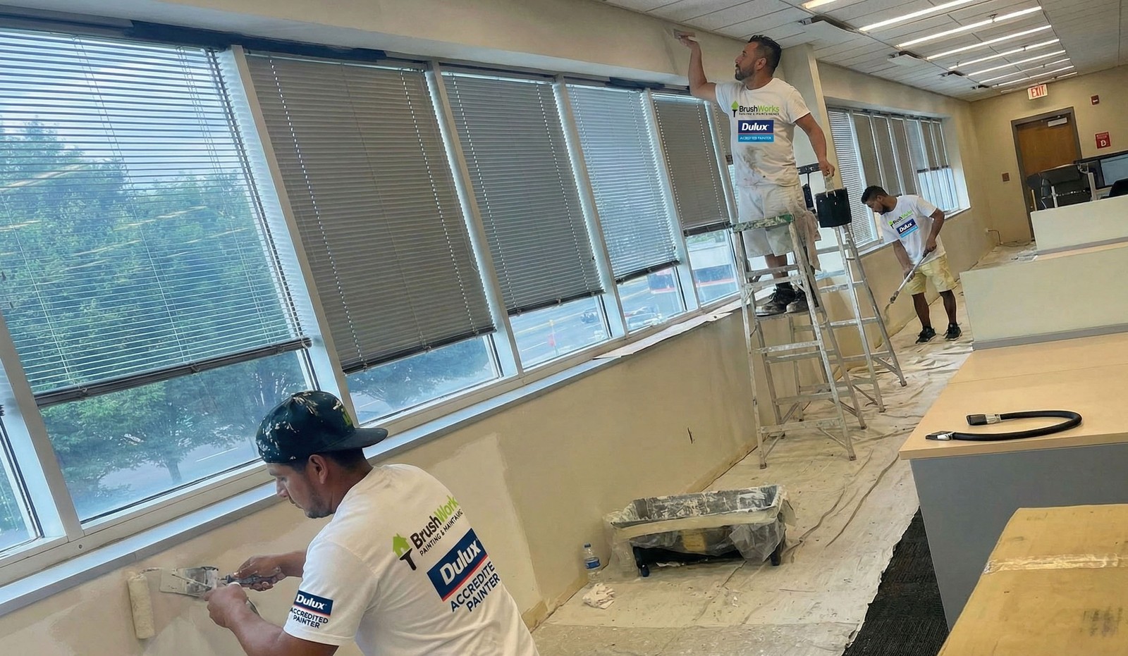 Professional painters completing an interior renovation